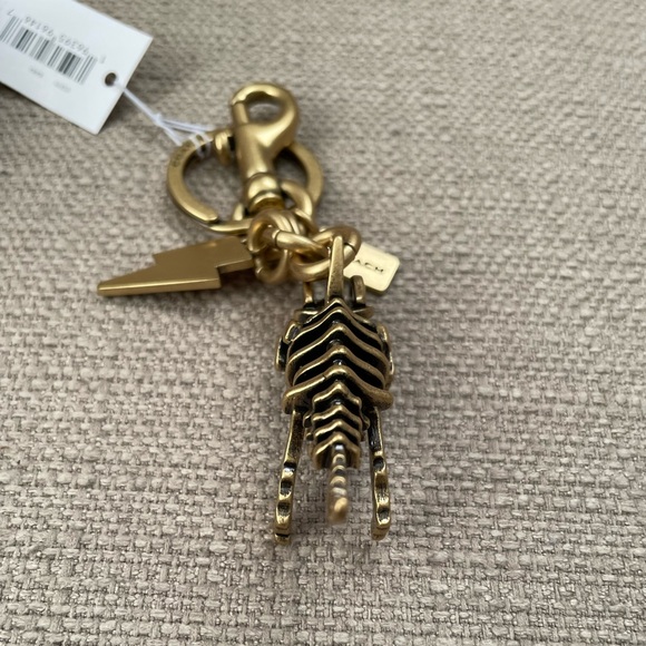 Coach Small Rexy Skeleton Bag Charm in colour brass - Picture 7 of 13